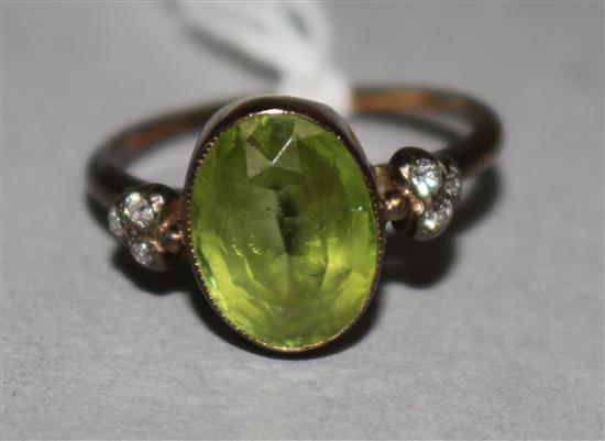 A yellow metal, peridot and diamond ring, size J.